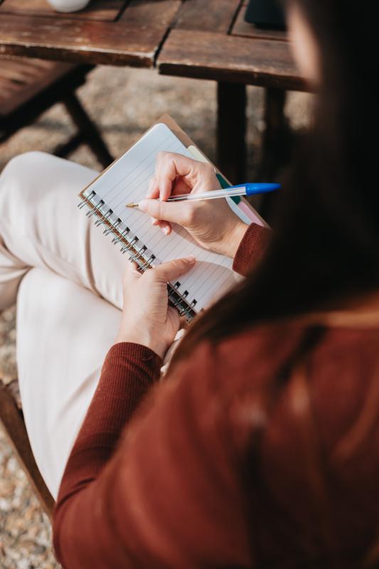 person with a notebook